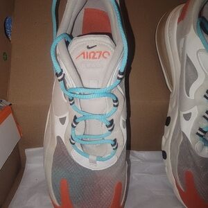 Nike White Sneaker with Teal Laces & Orange Accents